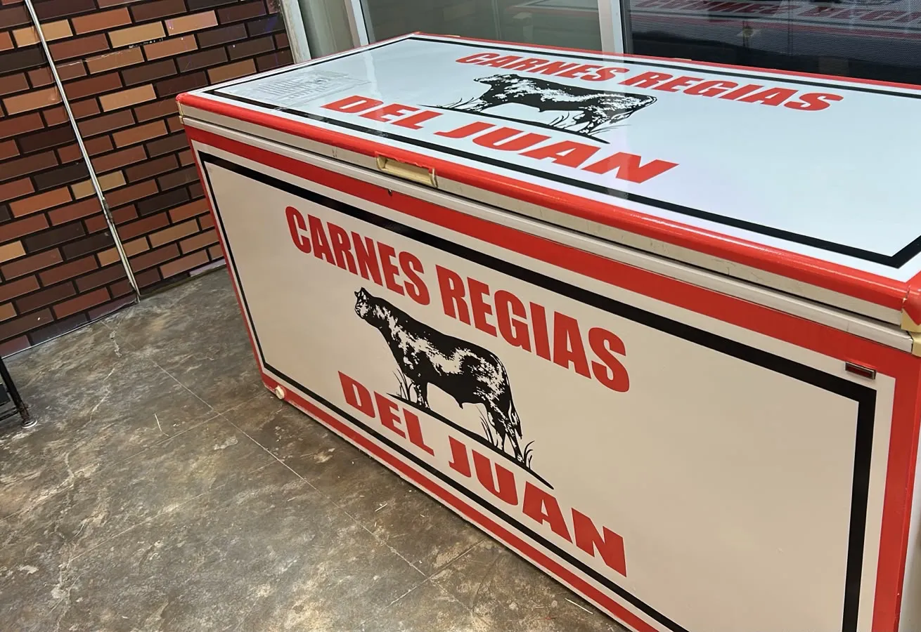 Freezer with beef boxes at the store