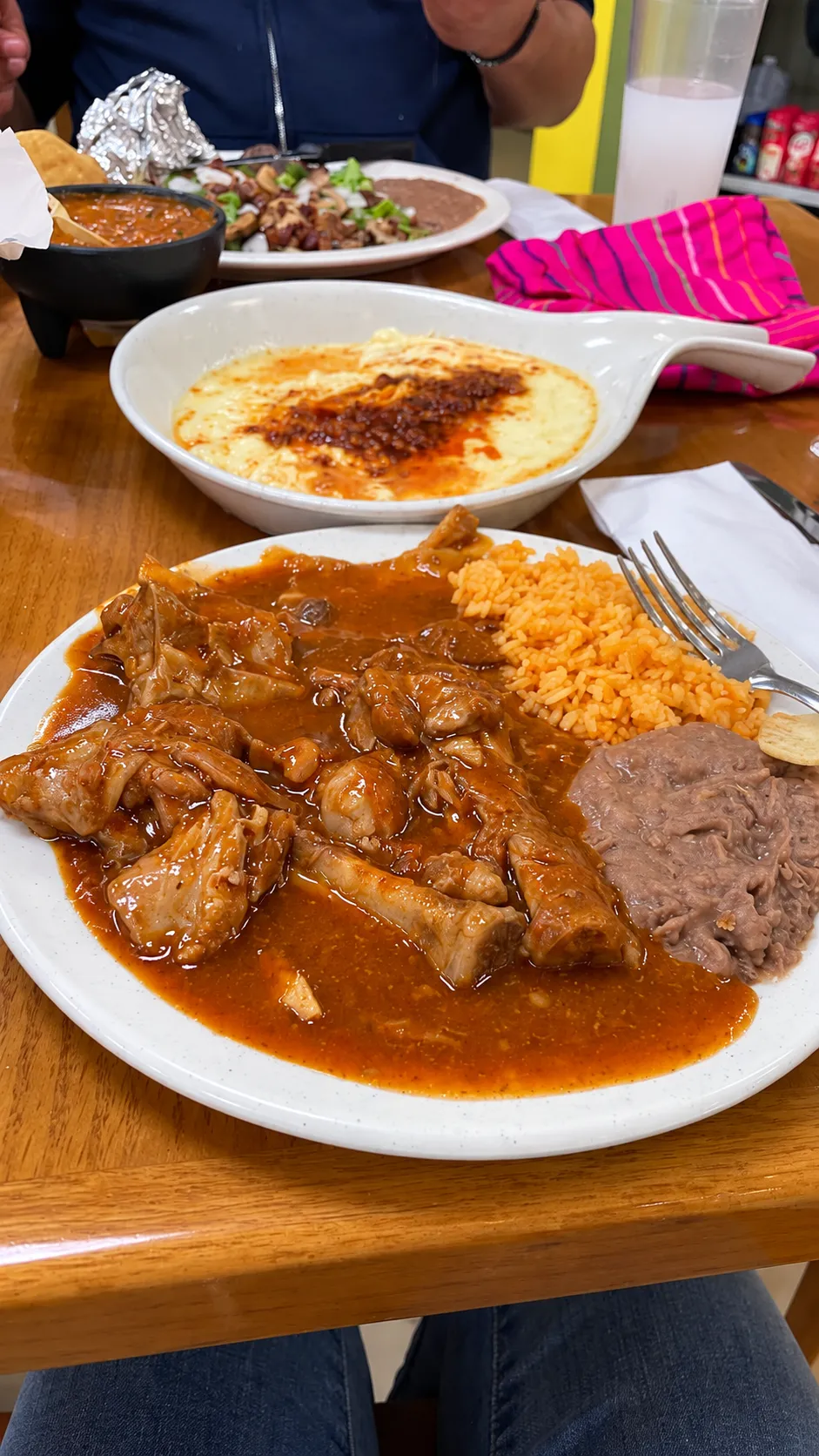 Ribs in red salsa and melted cheese