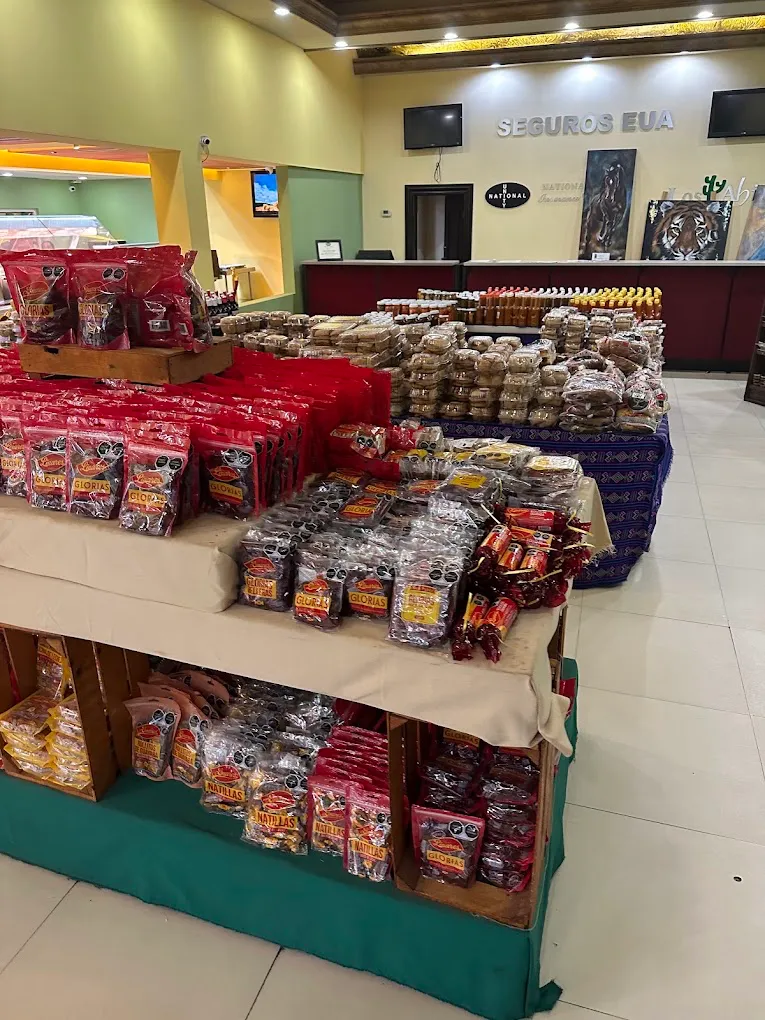 Table with glorias, natillas and regional sweets at the stop's store