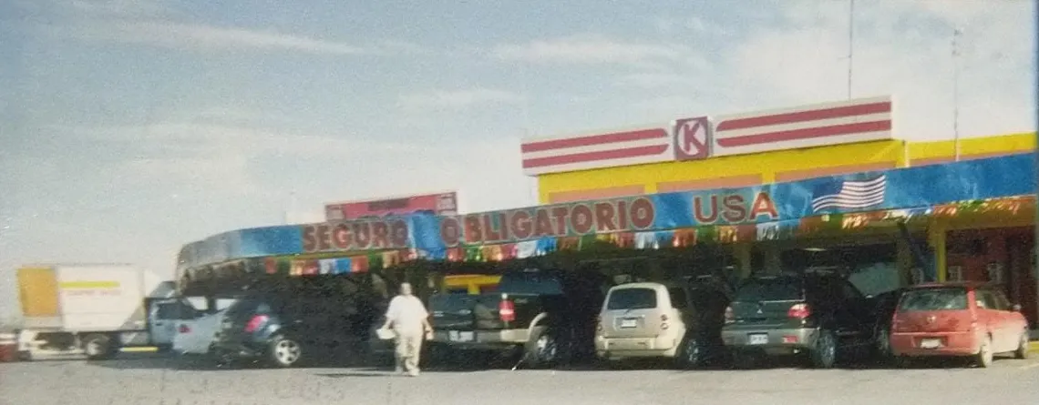 The Los Ahijados stop in its early years, with the Circle K store and a mandatory US insurance sign
